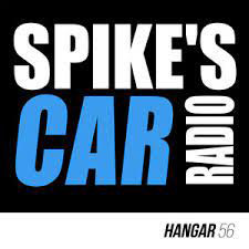 Image of white and blue text depicting spikes car radio against a black backgrond.